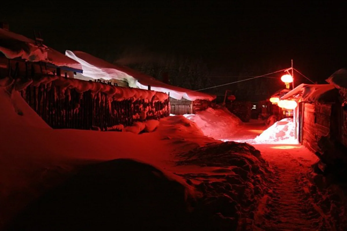 Beiji Village · Red lanterns along a snow-covered lane