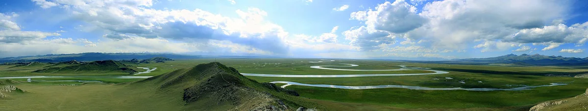 A wide panorama of rivers winding across Bayanbulak Grassland.