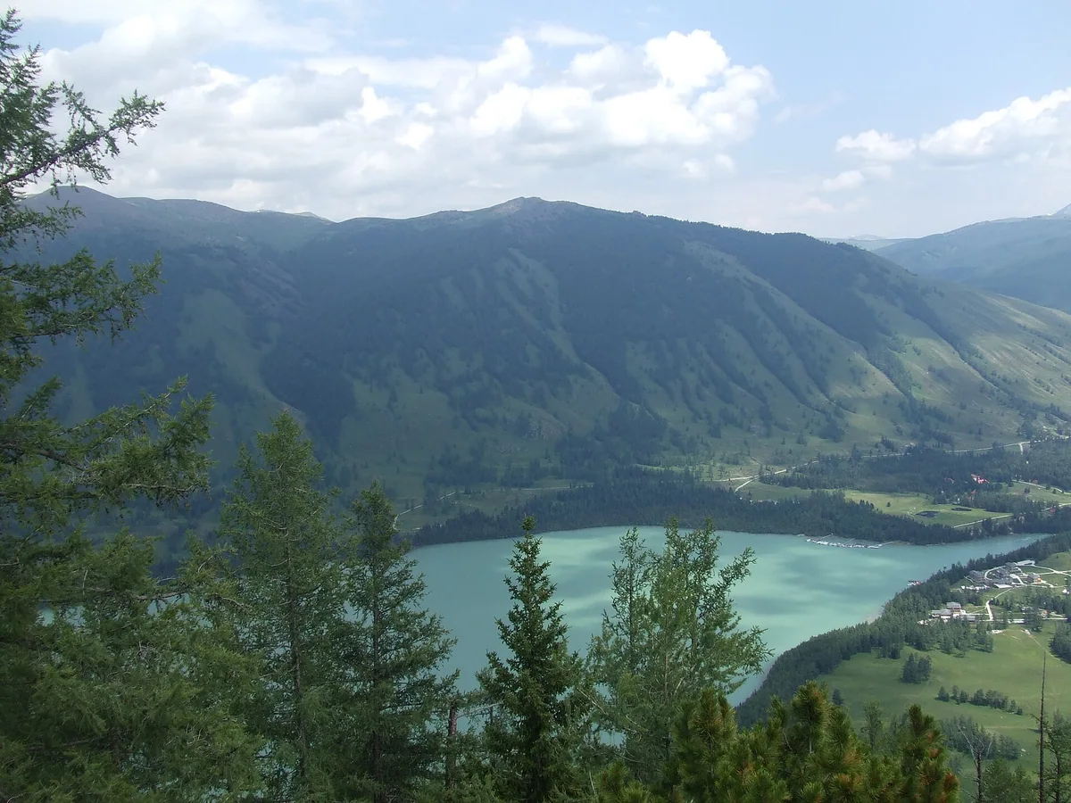 A quiet look back across a wooded bay of Kanas Lake.