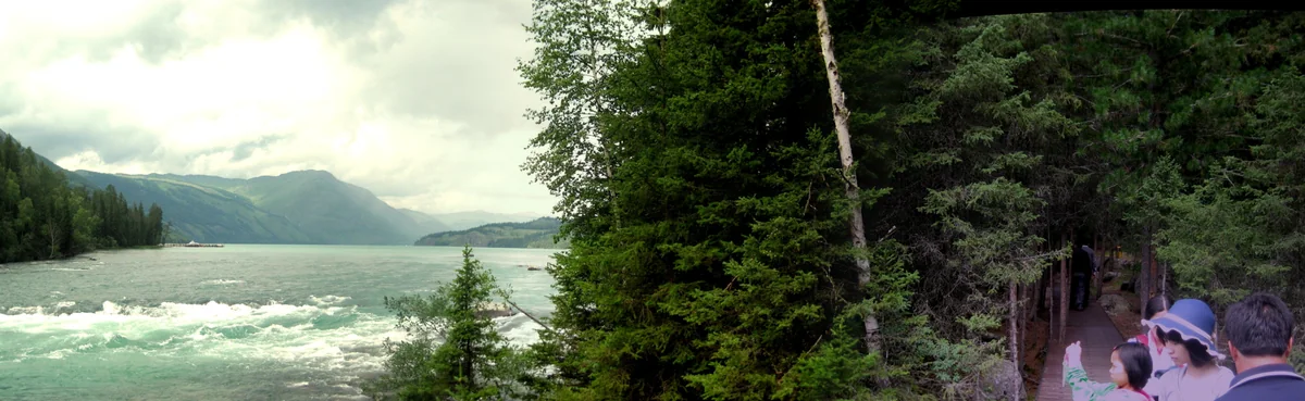 Water leaves Kanas Lake and follows the forested riverbanks downstream.